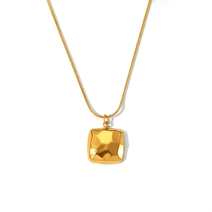 Detailed macro view of 18K gold-plated hammered square pendant on sleek snake chain necklace