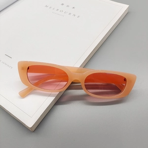 Detailed macro view of orange translucent square sunglasses frame with size markings