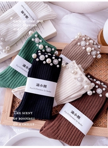 Detail of cotton crew socks with pearl and rhinestone embellishments in assorted colors