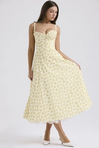 Detail view of yellow floral bustier maxi dress with elegant white lace hemline