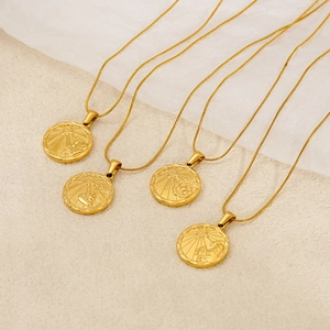 Gold plated zodiac coin necklaces with embossed celestial patterns on elegant snake chains