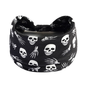 Elastic Halloween headband featuring white skull and bone patterns on a black wide band