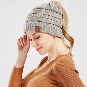 Winter grey cable knit beanie with high ponytail hole and leather C.C label detail