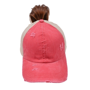 Detail of coral pink washed cotton baseball cap with high ponytail hole and mesh back