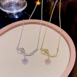 Elegant heart pendant necklace with bowknot and pink crystals in gold and silver finish