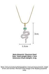 Detailed view of snake pendant necklace with green eyes and crystals on titanium steel