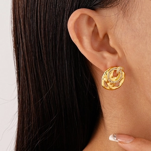 Irregular gold hollow round earrings with zircon accents and hammered metal texture