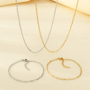 Set collana e bracciale a catena piatta testurizzata in finitura oro e argento