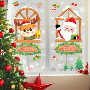 Christmas window decals with Santa Claus, reindeer, and snowflakes on a glass pane