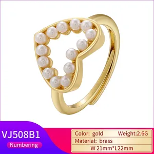 Adjustable golden brass open ring featuring a heart motif set with 13 white round pearls