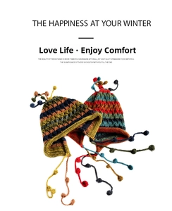 Close-up of bohemian knit earflap hats featuring colorful stripes and handmade tassels