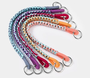 Detailed view of six colorful handmade paracord keychains with sturdy metal rings