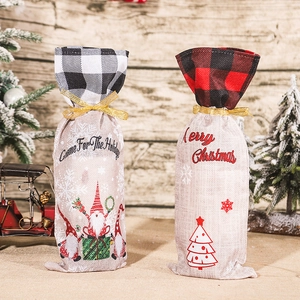 Christmas burlap wine bottle bags with gnomes and plaid ribbon for holiday decor