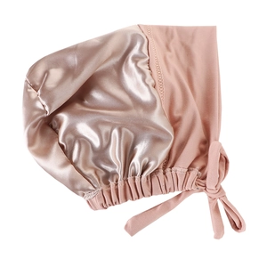 Detail showing champagne satin lining and pink stretch tie for women's hair bonnet