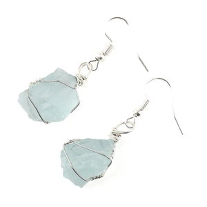 Close-up of handmade silver wire wrapped light blue natural stone crystal drop earrings