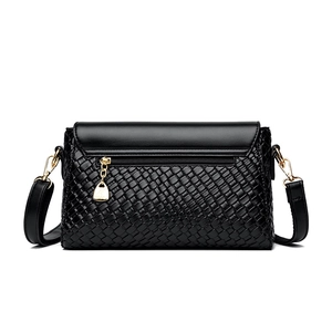 Classic black woven crossbody bag with gold zippers and adjustable shoulder strap