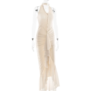 Detail view of cream halter dress featuring elegant pleated texture and ruffle trim