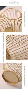 Detail of gold metal wire frame candle holder with rustproof baking paint finish