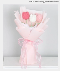 Close-up of hand-knitted tulip bouquet with delicate crochet texture and pink wrapping