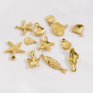 Polished gold stainless steel ocean charms including starfish and shells for DIY jewelry