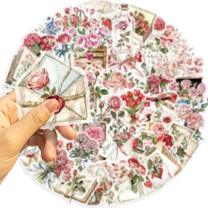 Close-up of vintage flower and letter PET stickers showing detailed watercolor printing