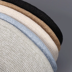 Detailed close-up showing layered textures and colors of the knitted paper sun hat brim