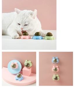 Three-way display of crab-shaped catnip balls in pink blue and green for cat play