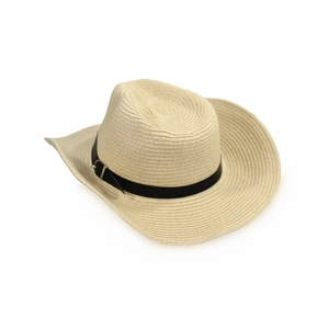 Close-up of beige straw cowboy hat with a black belt buckle and wide curled brim