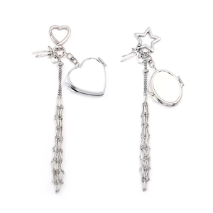Detail of silver mesh lipstick chain pendants with heart and star clasps and bows