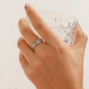 18K gold plated stainless steel ring featuring a black and white checkerboard enamel design