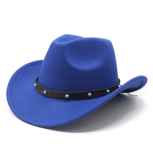 Close-up of royal blue western felt hat with turquoise studs on a brown leather band