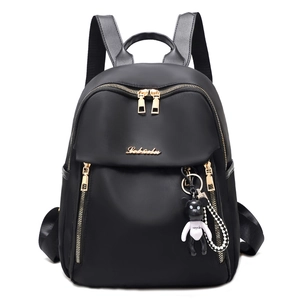 Chic black water-resistant oxford cloth backpack with gold zippers and panda charm