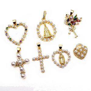 Detailed view of seven gold-plated pearl and cubic zirconia pendants in various shapes