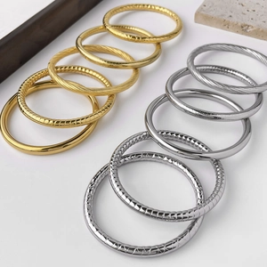 Fashionable waterproof titanium steel bangle collection with grid and spiral textures
