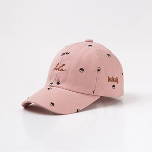 Pink cotton baseball cap with artistic hola embroidery and unique eye pattern accents
