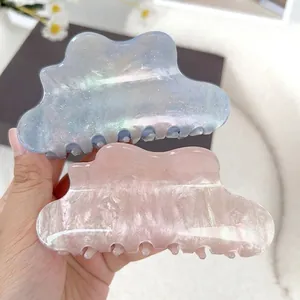 Elegant glittery cloud hair claws in iridescent purple and pink pearl acrylic finish