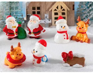 Miniature resin Christmas set with Santa, snowmen and reindeer on faux snow