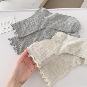 Breathable mesh knit crew socks with ruffle cuffs in grey and beige colors