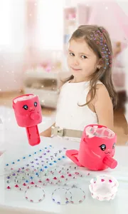 Kids DIY hair bedazzler kit with pink styling tool and colorful rhinestone gems