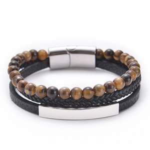 Detail of multilayer leather bracelet with tiger eye stones and silver magnetic clasp