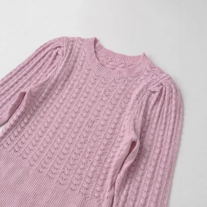 Pink crew neck knit sweater with elegant openwork patterns and long puff sleeves