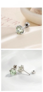 Detail of 6mm mint green zircon studs with dragon claw setting and screw back closures
