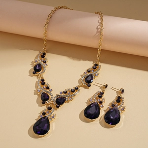 Vintage gold necklace and earring set with purple water drop crystals and diamonds