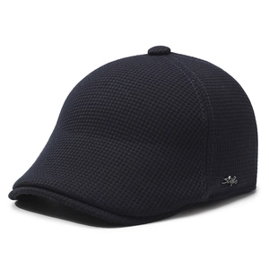 Navy blue winter flat cap for men with ear flaps and warm fleece lining shown in 45-degree view