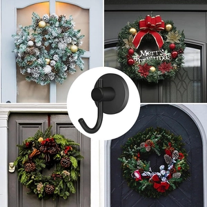 Detail view of black magnetic hook used for hanging Christmas wreaths on various doors