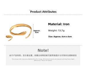 Detail view of gold snake-shaped metal cuff bracelet with 13.7g weight and 6cm size