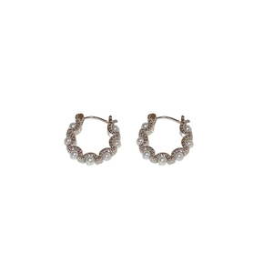 Minimalist silver circle hoop earrings with pearl inlay and wavy textured edges
