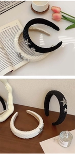 Detail of wide woven headbands with sparkling star accents in black and beige colors