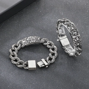 Retro stainless steel cross pattern bracelets with vintage silver finish on dark texture