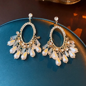 Vintage gold oval earrings with cascading pearls and crystals in luxury tassel style